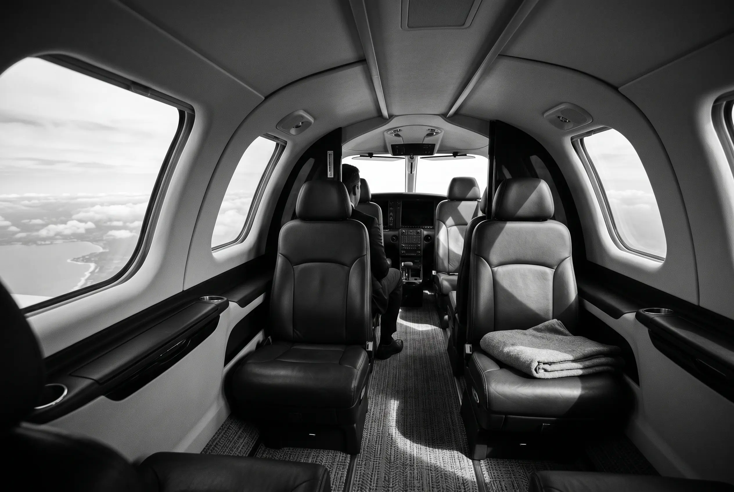 Cirrus Vision Jet G2+ cabin for a New York to Miami charter, in black and white