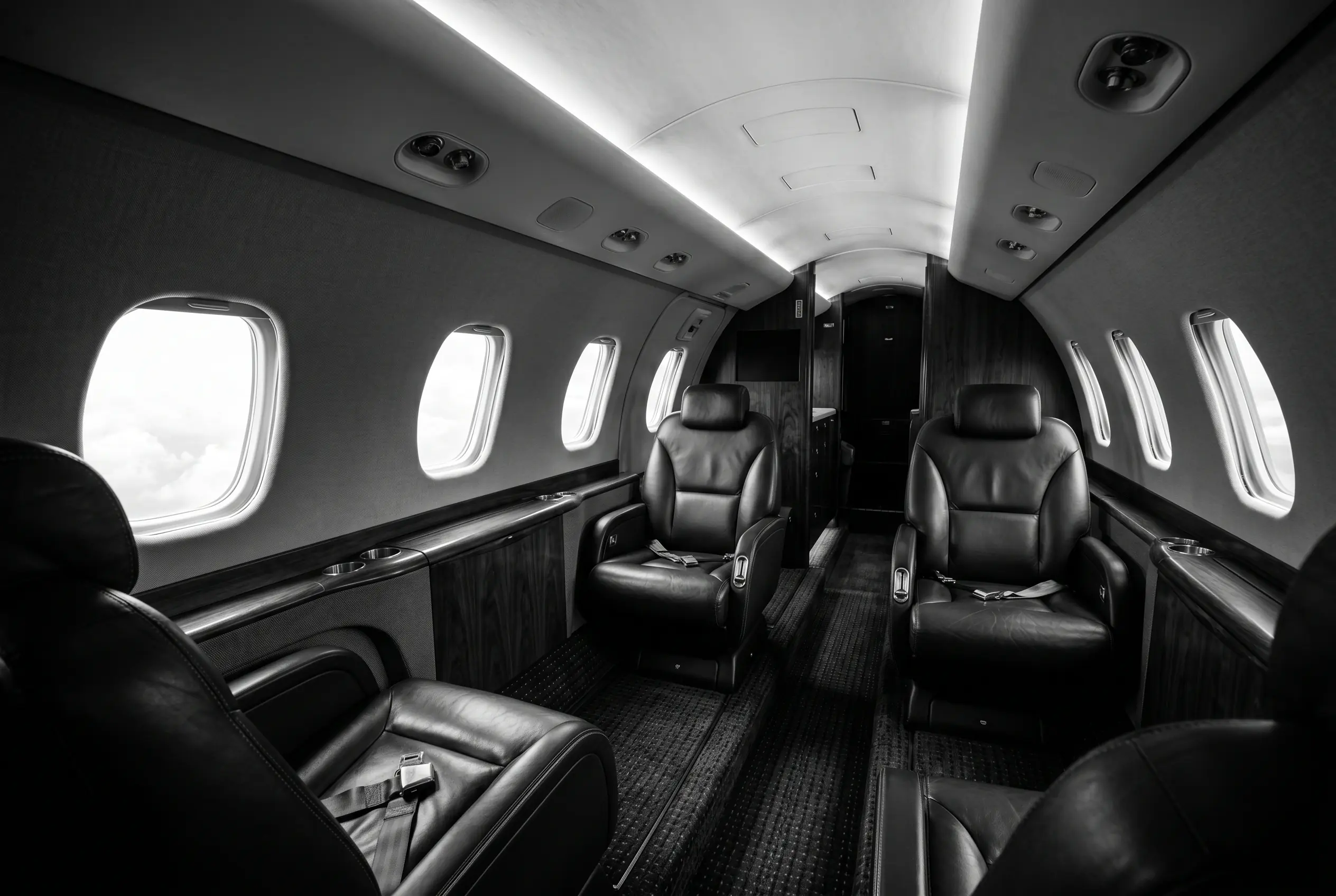 Cessna Citation Excel stand-up cabin for a New York to Miami charter, in black and white