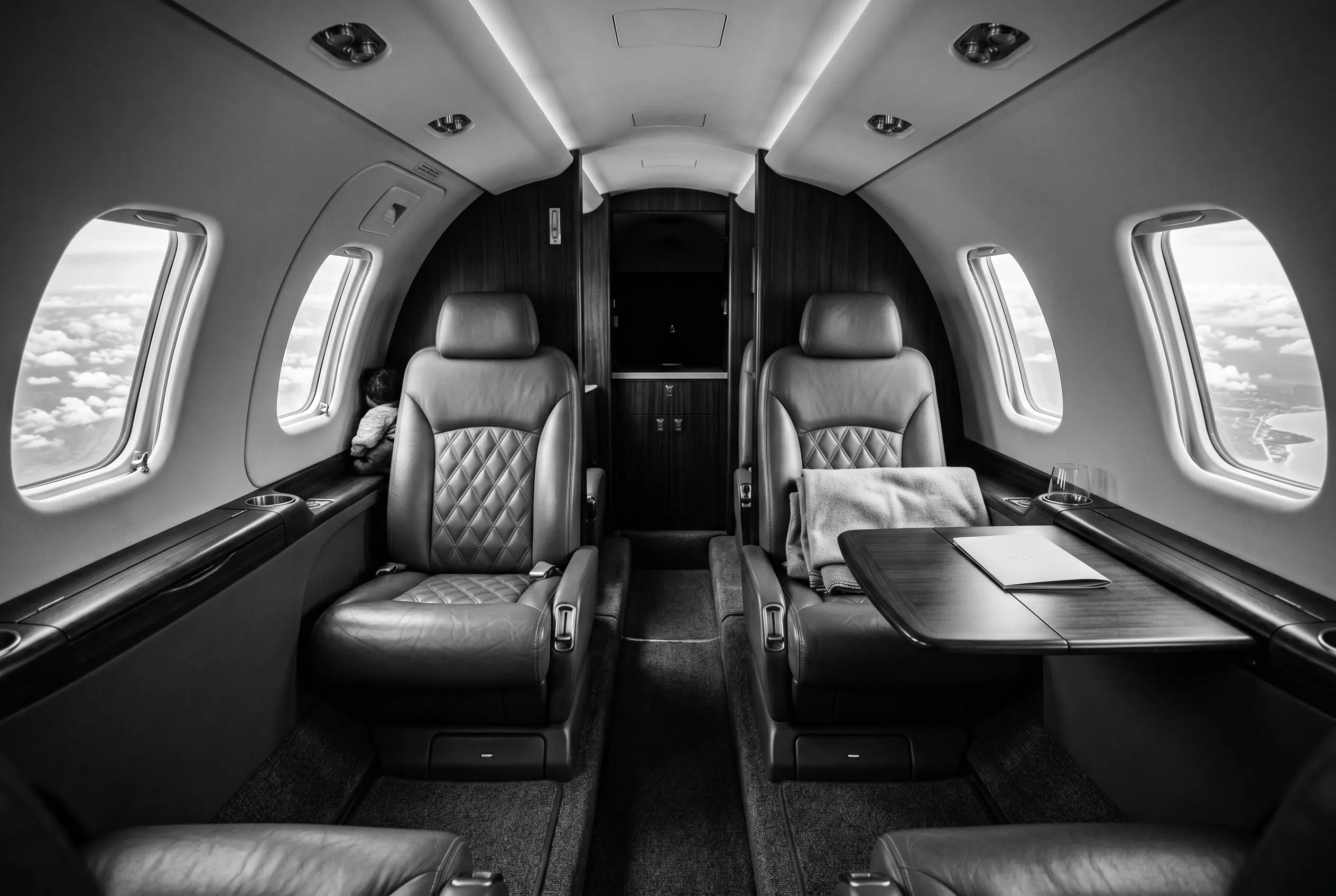 Cessna Citation M2 cabin for a New York to Miami charter, in black and white