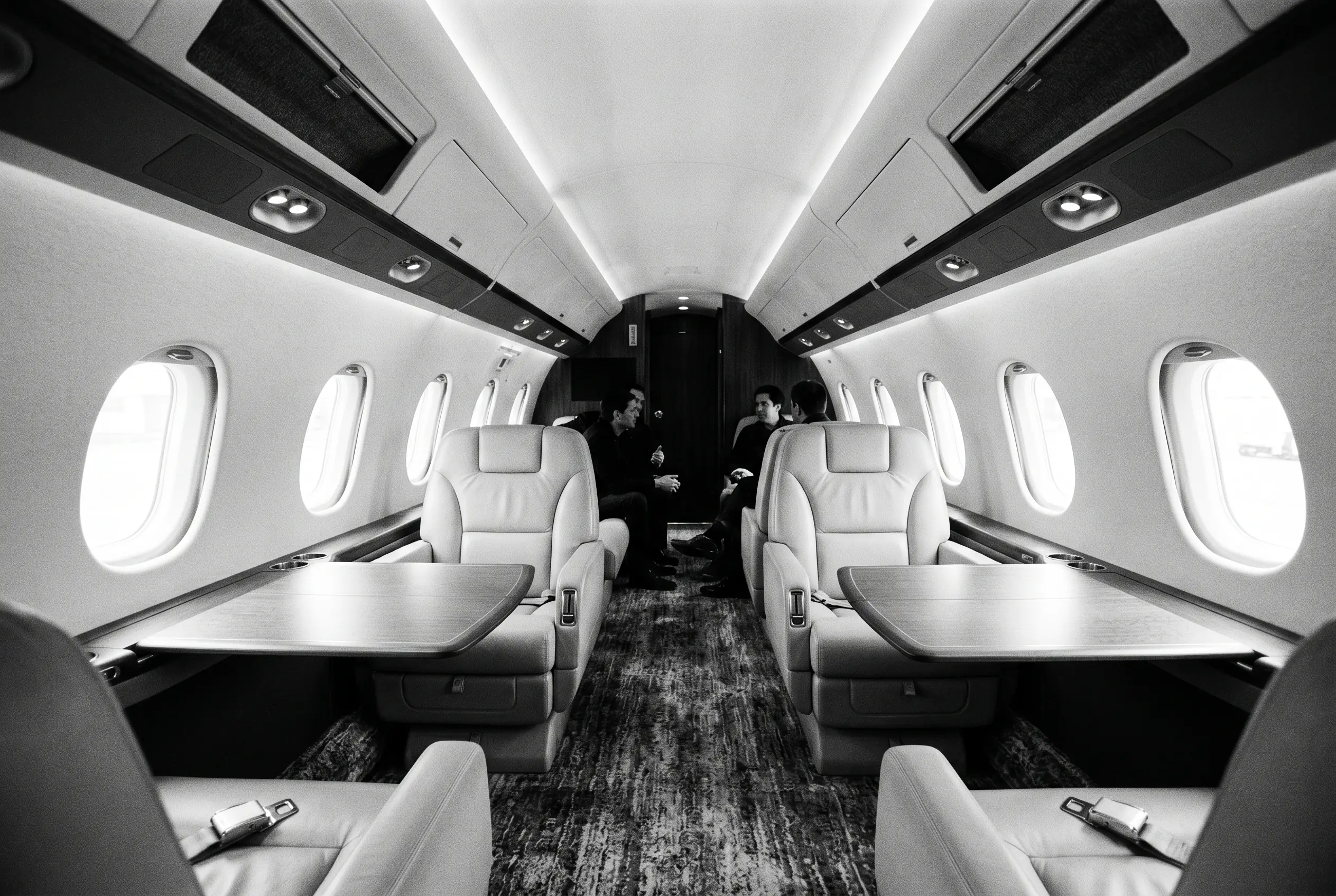 Dassault Falcon 2000LXS wide cabin for a New York to Miami charter, in monochrome