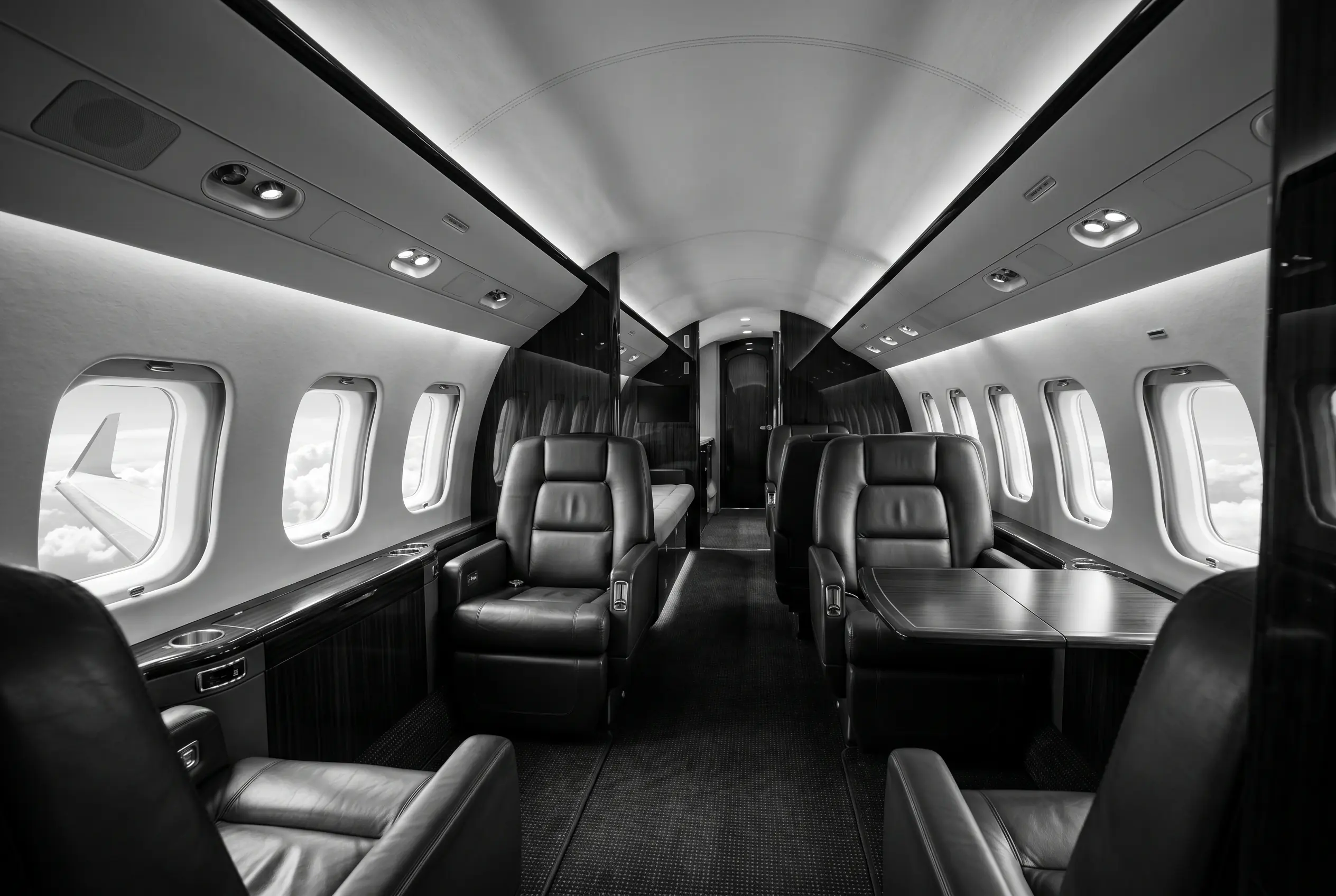 Dassault Falcon 7X cabin for a New York to Miami charter, in monochrome