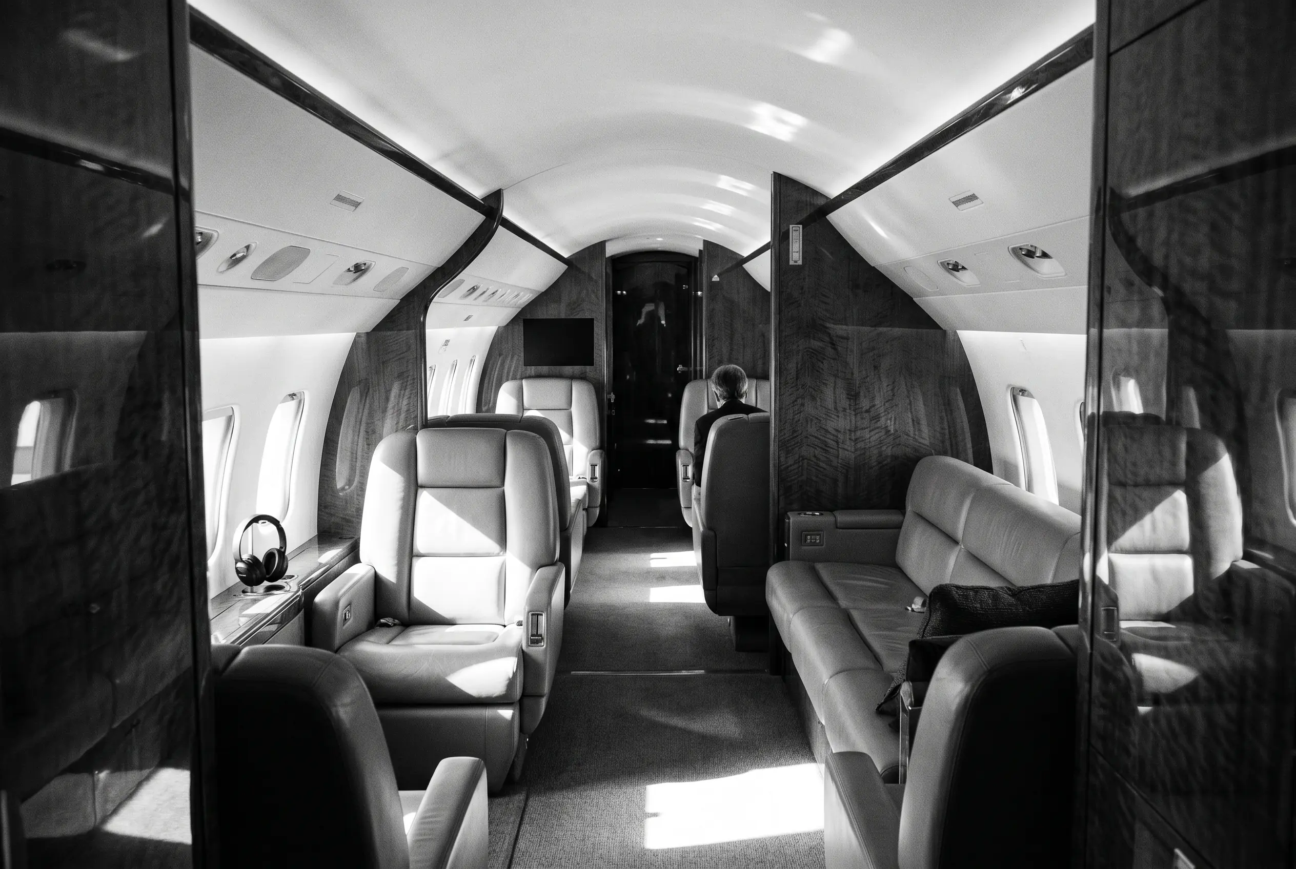 Bombardier Global 5000 wide large cabin for a New York to Miami charter, in monochrome