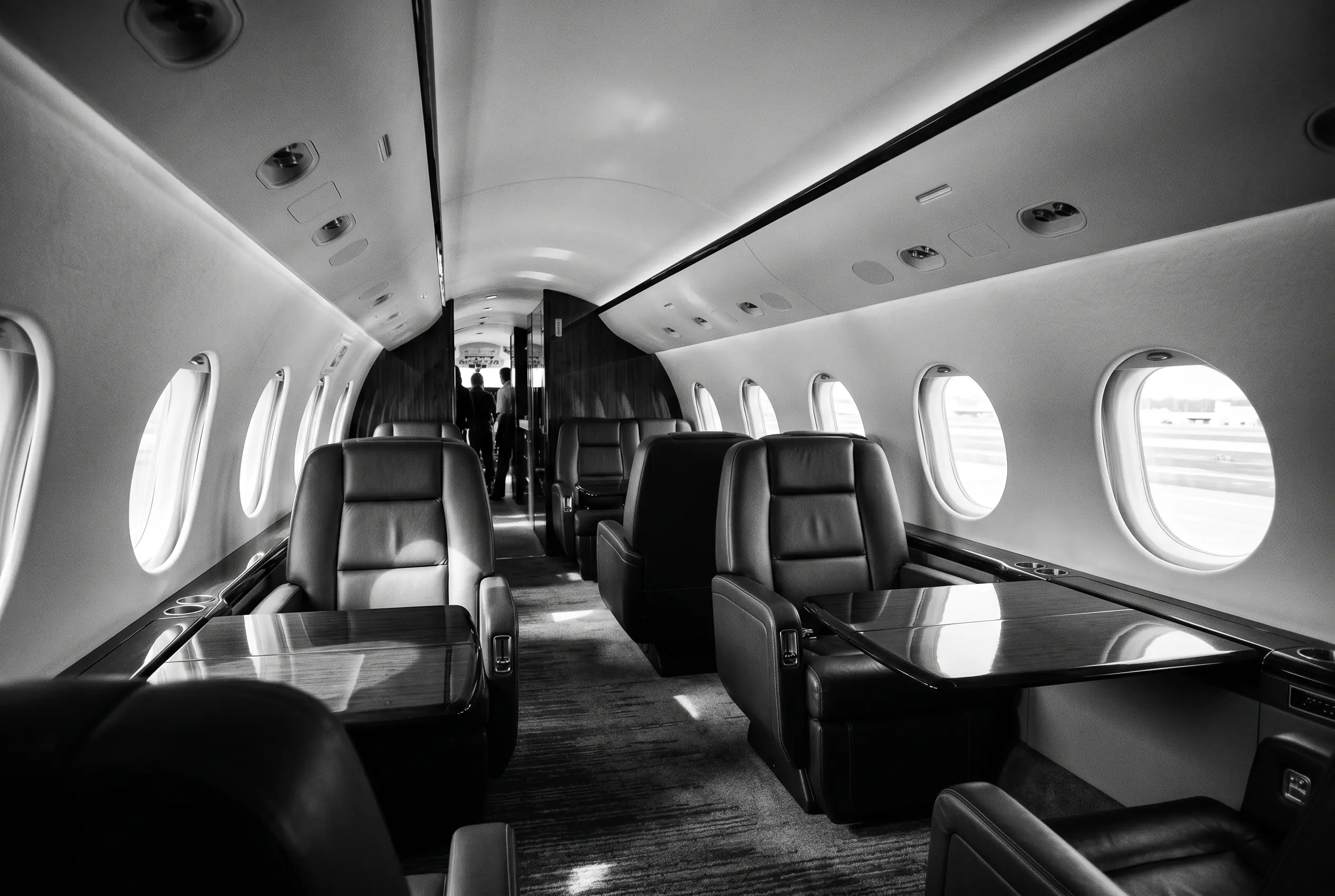 Bombardier Global 5500 wide cabin for a New York to Miami charter, in monochrome