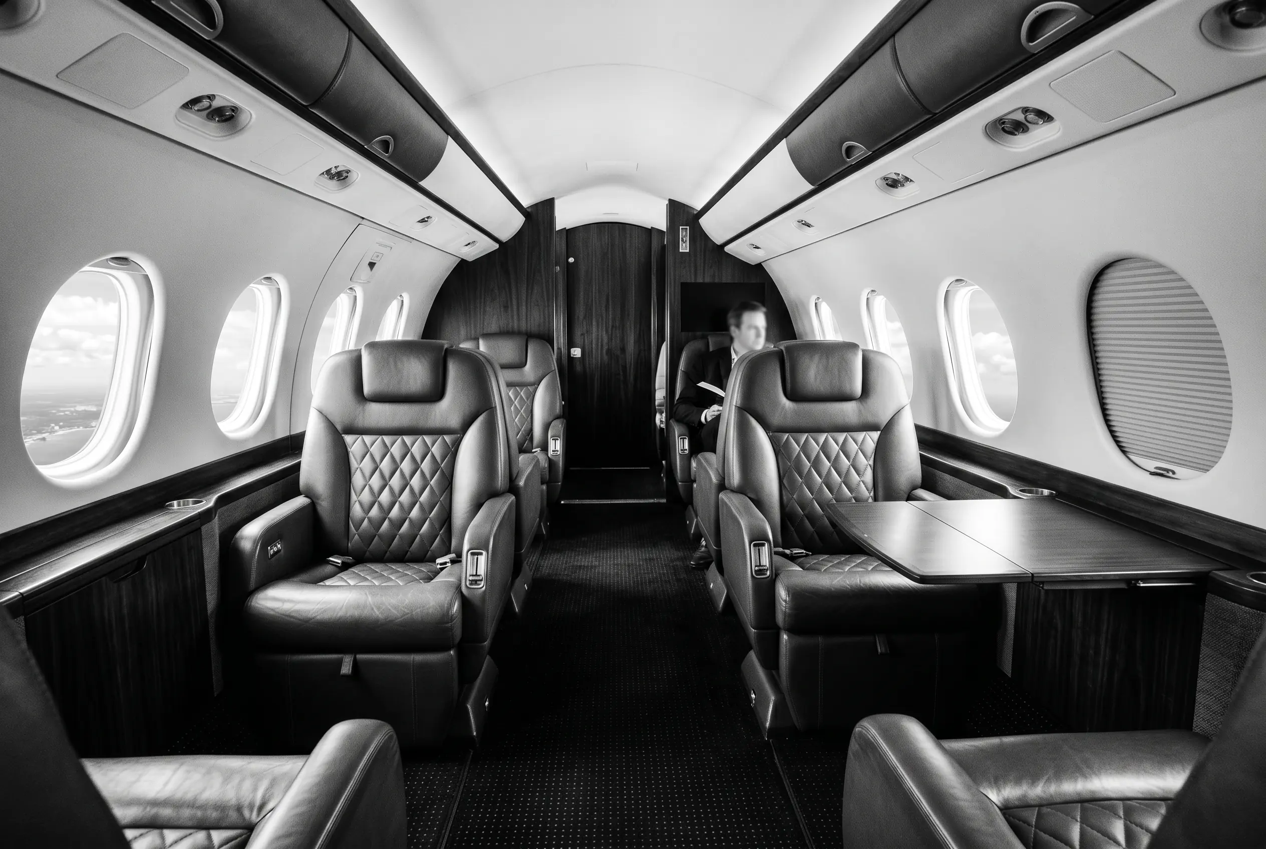 Gulfstream G150 cabin for a New York to Miami charter, in black and white