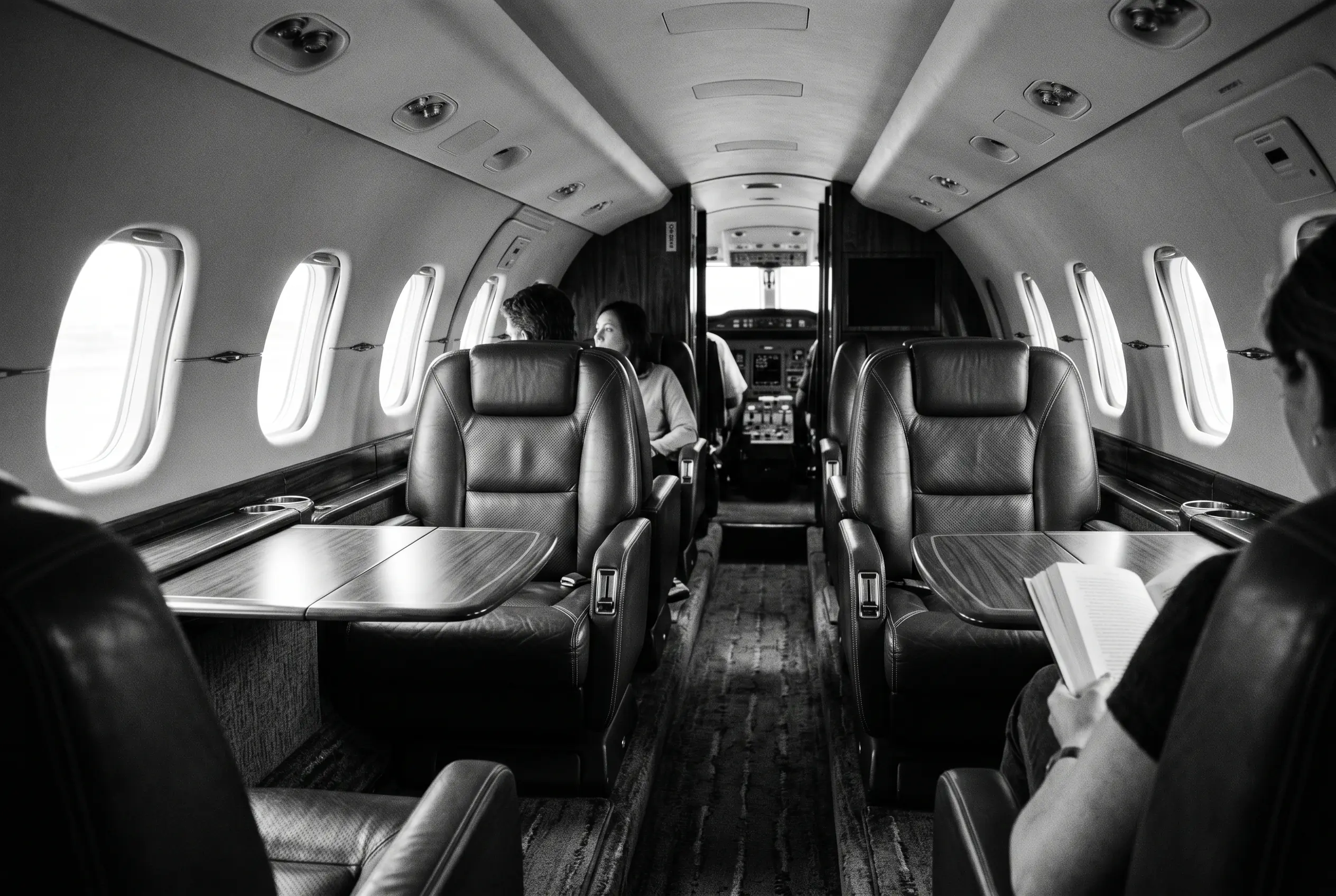 Bombardier Learjet 60XR cabin for a New York to Miami charter, in monochrome